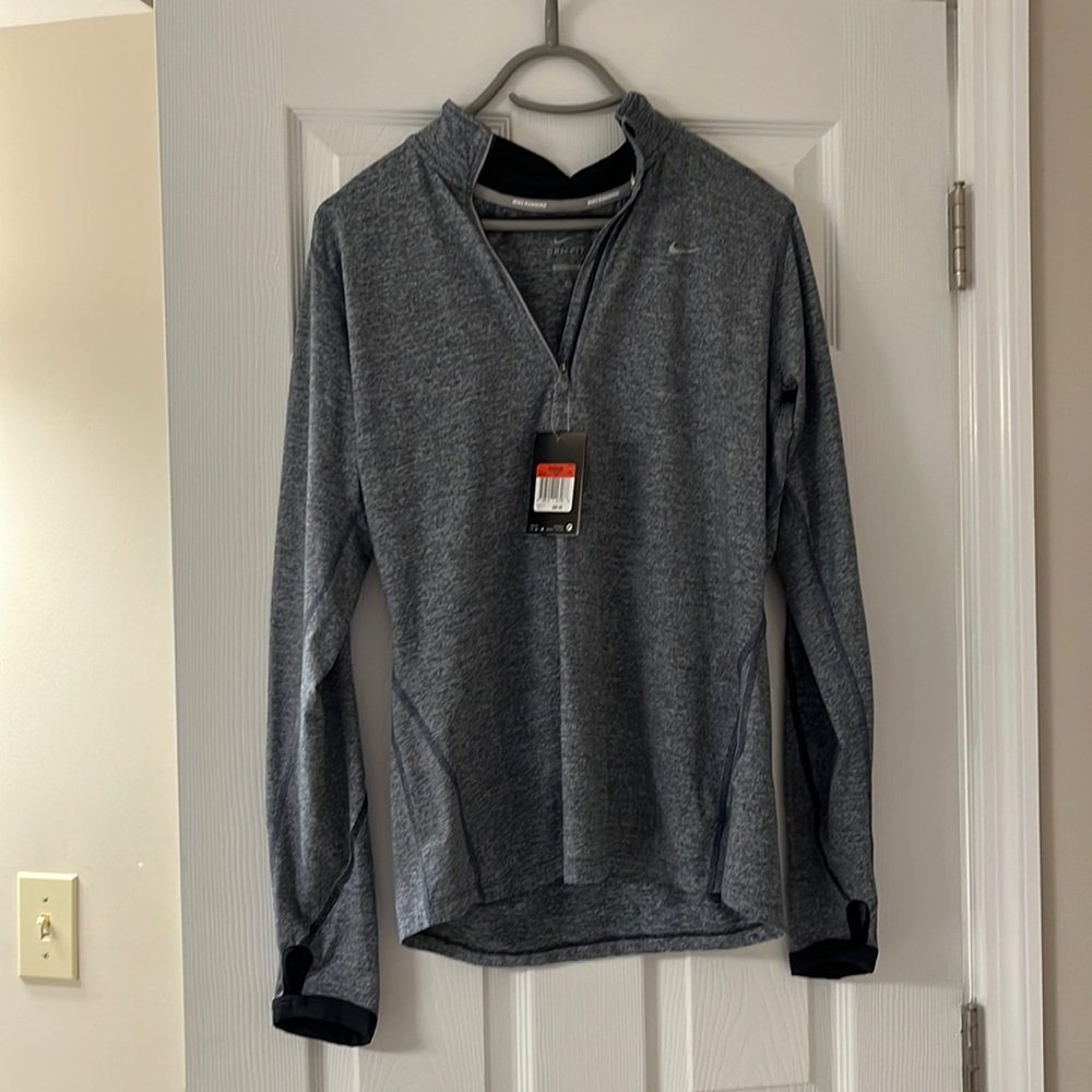 New with tags Nike half zip pullover in a Heather gray/navy print.